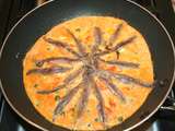Omelette à la tomate, anchois et câpres
