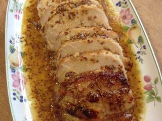 Rôti de porc à la moutarde, miel et orange