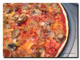 Pizza pâte fine (jambon,champignons,mozzarella)