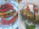 Deux antipasti : roulés de courgettes grillées au fromage frais et poivrons cornus grillés à l'huile d'olive